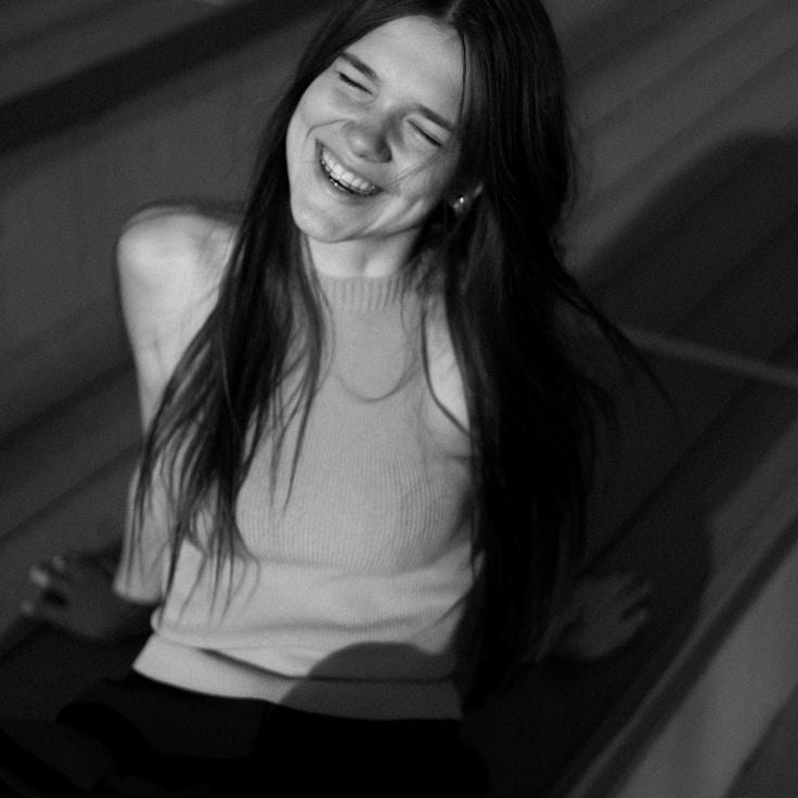 Aanya Rao, Lead Design Curator at Verdant & Vine, reviewing corporate floral arrangements